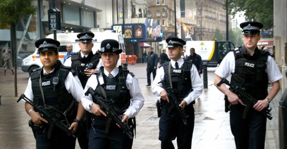 Armed British police patrol London's Leicester Square, Thursday July 28, 2005. Police in London were on high alert, while the search for three suspected London bombers continued. Anti-terrorist officers investigating the July 21 failed attacks on the British capital arrested nine men in south London on Thursday.(AP Photo/Max Nash)