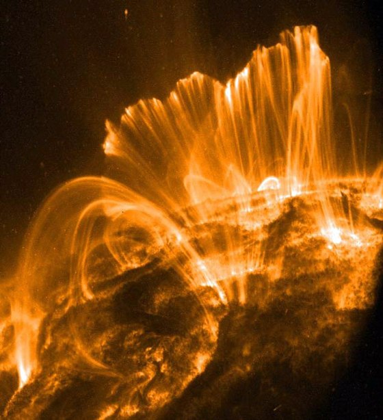 Solar flares follow lines of magnetic force looping up from the sun's surface during an eruption.