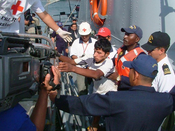 One of the nine survivors (C) of a ship