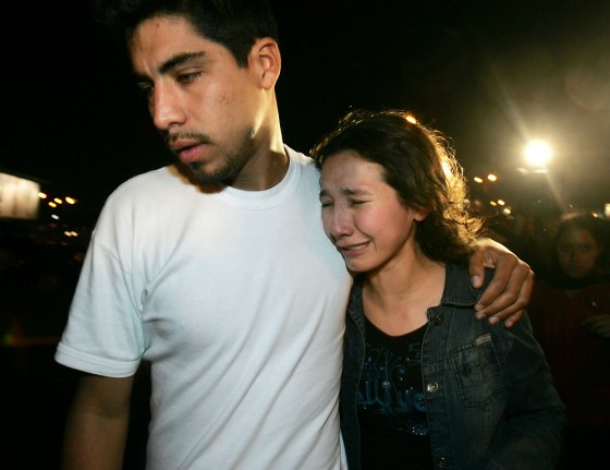 Unidentified relatives of victims of a downed Peruvian airliner arrive at Jorge Chavez airport in Lima, Peru, on Tuesday.