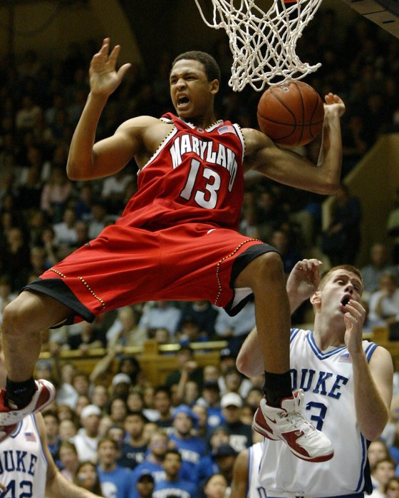 Maryland's Chris McCray celebrates after dunking against Duke