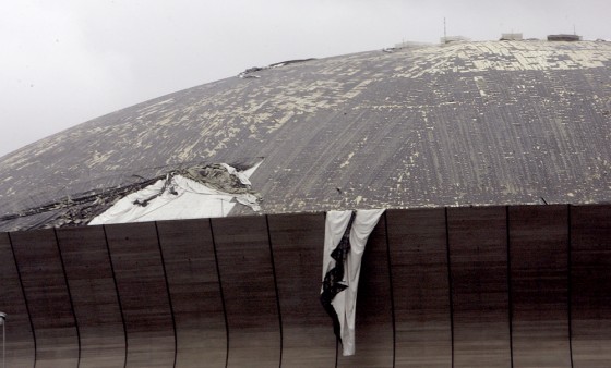 The roof of the Louisiana Superdome is shredded by Hurricane Katrina's strong winds on Monday.