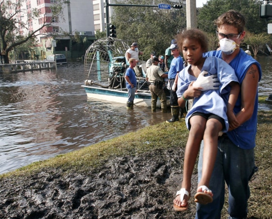 A young patient at Charity Hospital in New Orleans is carried to a waiting bus after being evacuated by airboat on Sept. 2.