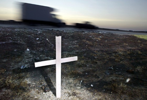 A single cross marks the scene where a bus carrying Hurricane Rita evacuees from a Houston nursing home burst into flames on Sept. 23, killing 23 people.