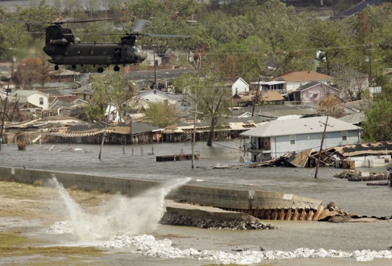 A Chinook helicopter drops sandbags Sunday to repair the breach in the Industrial Canal levee in New Orleans.)