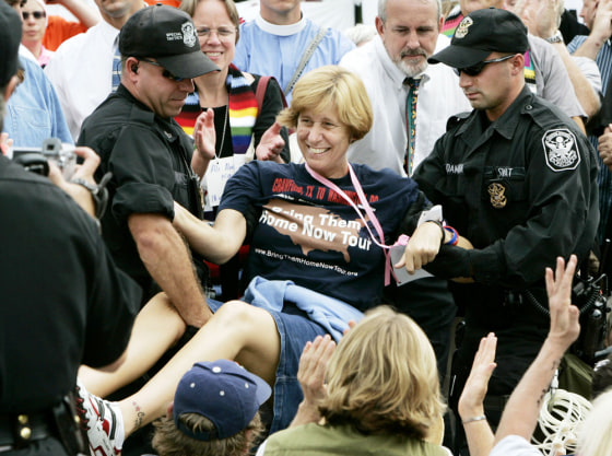 Anti-war protester Sheehan is arrested in front of the White House during protest in Washington