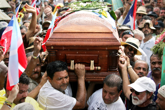 Men carry the casket of Puerto Rican nationalist Filiberto Ojeda Rios Tuesday as a crowd of supporters look on in eastern Puerto Rico. Rios' killing in a shootout with the FBI has brought a new chill to Puerto Rico's uneasy relationship with the United States.