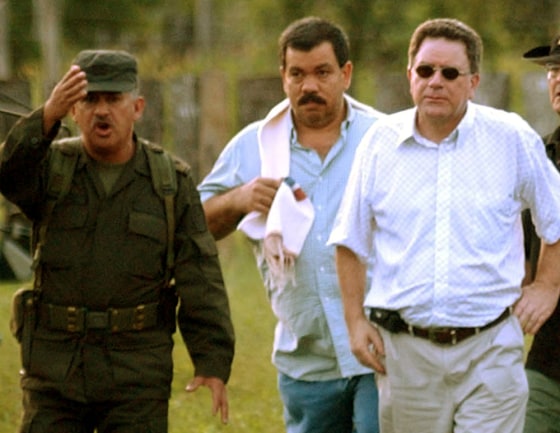 Diego Fernando Murillo, center, seen in this May 2005 photo, is wanted in New York for allegedly exporting tons of cocaine to the U.S. 