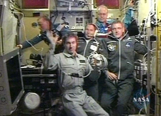 ISS Commander Krikalev waves from aboard the Zvezda module after successful docking with Soyuz spacecraft