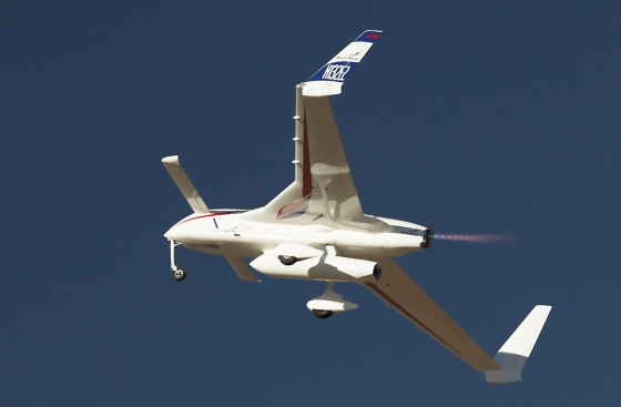 XCOR Aerospace's EZ-Rocket plane makes a banking turn during a practice run in preparation for the Personal Spaceflight Exposition in Las Cruces, N.M.