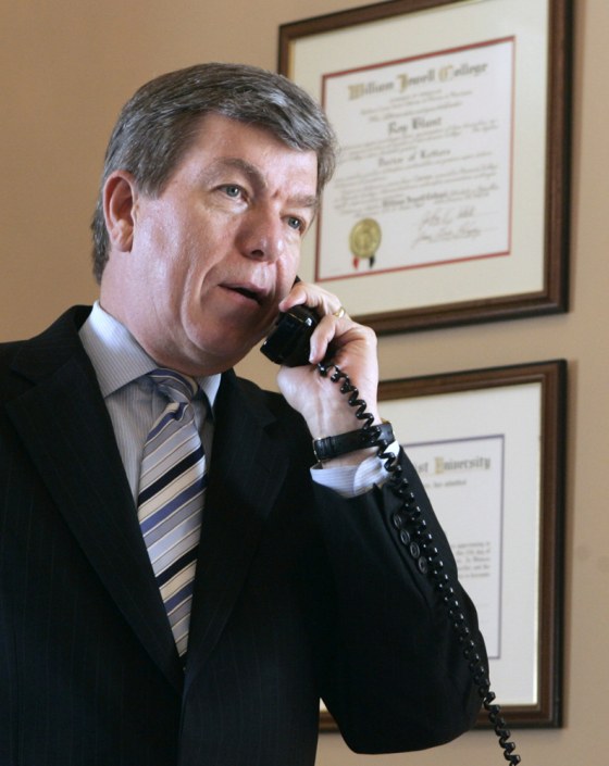 Temporary House Majority Leader Roy Blunt works telephone first day on new job