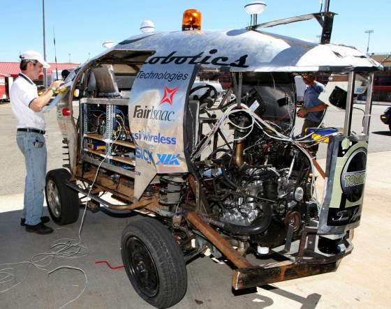Perrone works on robotic vehicle \"Tommy\", set to take part in DARPA 2005 challenge race, in Fontana