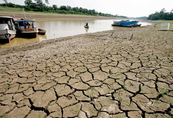 Mud cracks form as an Amazon tributary dries up near the city of Manaquiri during worst drought in decades