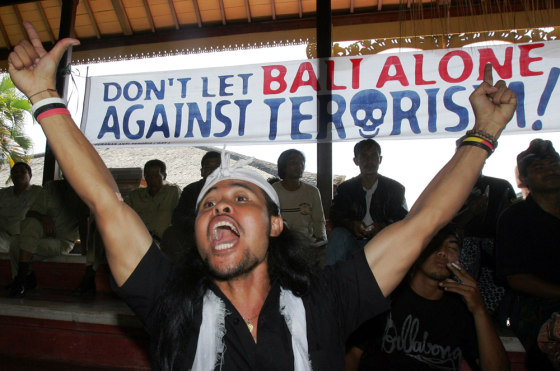 PROTESTER SHOUTS SLOGANS