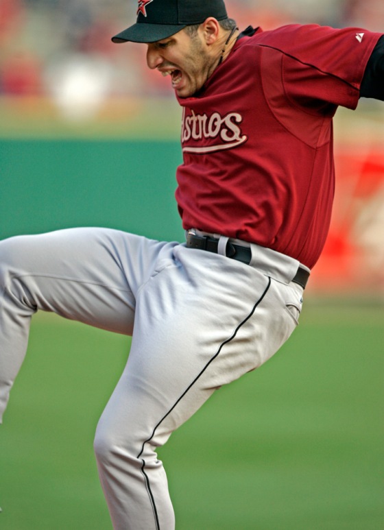 Houston pitcher Andy Pettitte leaps in pain after getting hit by a ground ball during the team's batting practice prior to Game 1 of the National League Championship Series on Wednesday. Pettitte was warming up running the bases when he was hit.