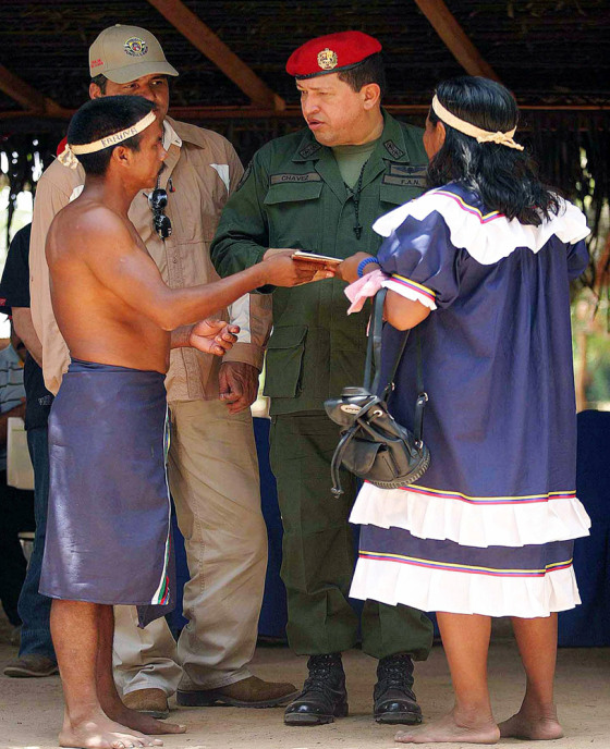 Venezuelan President Chavez speaks at ceremony to hand land titles and farming equipment to indigenous groups in Apure State