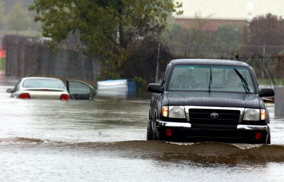 A truck makes a U-turn after attempting to cross a flooded area in Enfield, Conn., on Saturday.