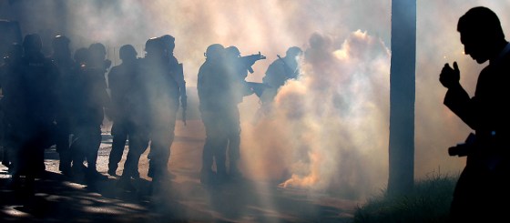 Clouds of tear gas fill the streets of Toledo, Ohio, on Saturday after violence erupted between people protesting a planned white supremacist march and local police.