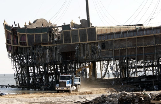 A truck hauls away debris from what remains of the Treasure Bay Casino in Biloxi, Miss., on Oct. 8.
