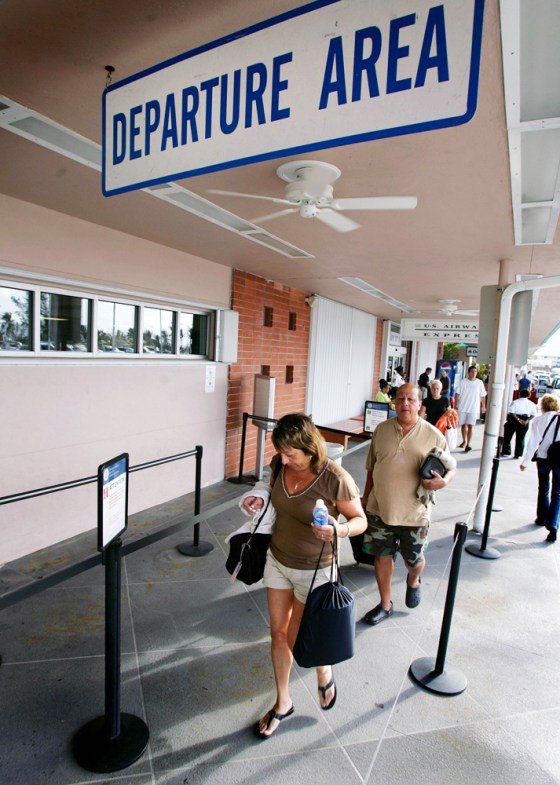 Tourists leave airport of Key West while hurricane Wilma heads towards Floridas southern west coast