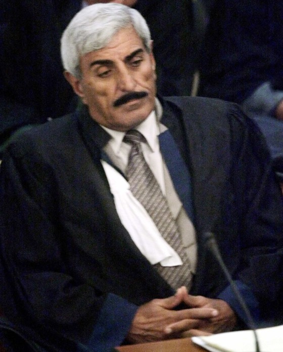 Iraqi lawyer Janabi appears in the court on Wednesday's opening session of the trial of Iraq's former president Hussein and seven co-defendants in Baghdad