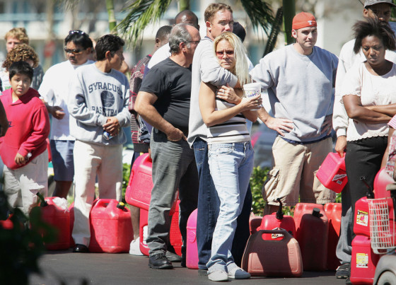 People wait in line to purchase gas after Hurricane Wilma hit West Palm Beach