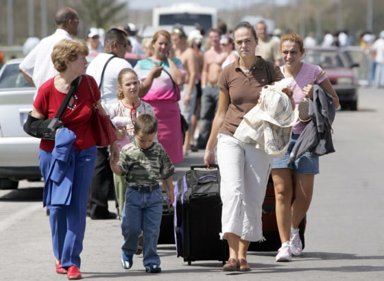 Foreign tourists arrive at Cancun 's international air port as they prepare to fly out of the Mexican Caribbean resort