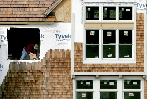 A worker sets a window sill on a new home under construction in South Russell, Ohio last month. On Thursday, the government reported sales of new U.S. homes rose more slowly than expected in September.