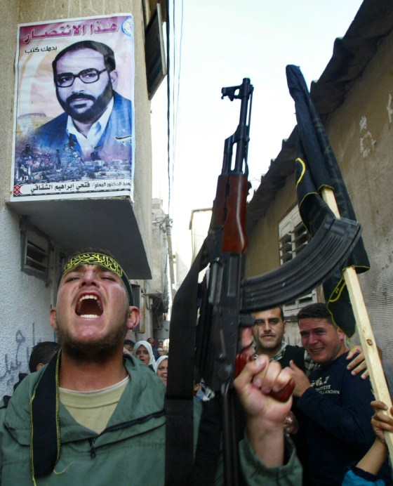 Relatives of Shadi Mohanna, an Islamic Jihad commander in the Gaza Strip, march through the streets of the Jebaliya refugee camp, adjacent to Gaza City, on Friday. Mohanna was among those killed in an Israeli airstrike Thursday night.