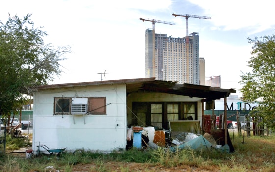 Manuel Corchuelo's 700-square-foot house in the Las Vegas neighborhood of Naked City, purchased for $30,000 in 1978, is currently on the market for $1.2 million. The tract home is rapidly being surrounded by high-rise condominium projects.