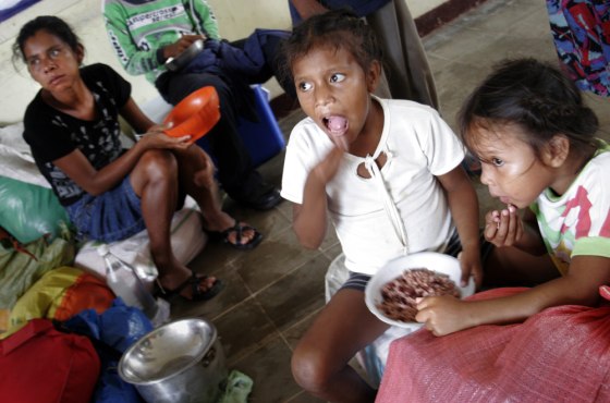 Children eat a rice meal at the shelter in the Ducado de Luxemburgo Normal School, in Puerto Cabezas, 335 miles northeast of Managua, Nicaragua, on Sunday.
