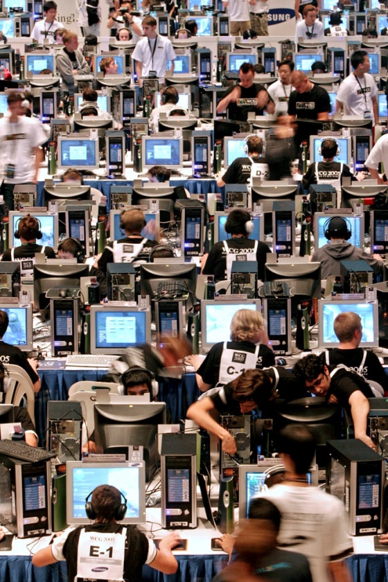 Competitors prepare to take part in gaming tournaments during World Cyber Games in Singapore