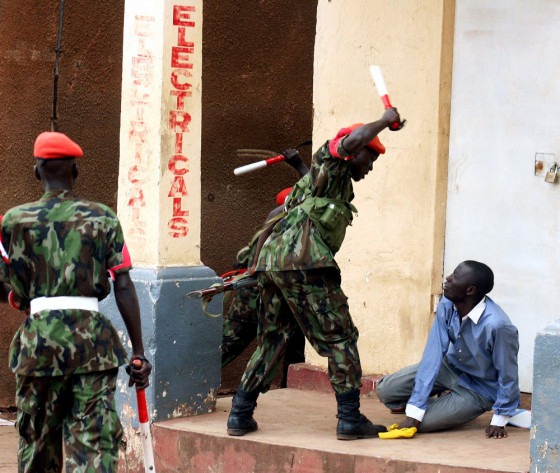 Ugandan military police disperse supporters of opposition leader Besigye during riots in Kampala