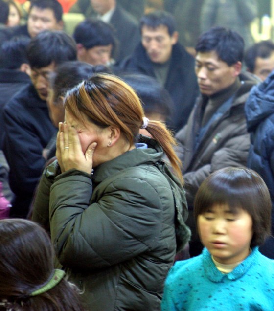 Family members and miners wait for news