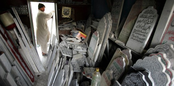 Mohammad Mumtaz Mughal works in his gravestone workshop in Muzaffarabad