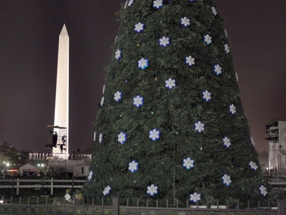 Lighting technicians work on the finishing touches as preparations are made for the lighting of the National Christmas tree on the Ellipse in Washington, D.C., on Wednesday.