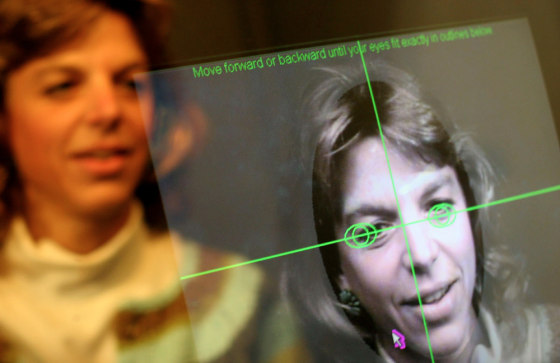 Jen Bryant, who was spending the long holiday weekend in Baltimore with her family, tries out "The Race Machine," at the American Visionary Art Museum.