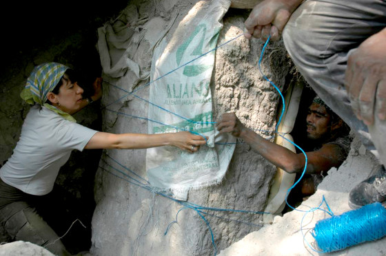 University of Calgary student Alejandra Alonzo helps wrap up a 4th-century stela at Naachtun, a Mayan archaeological site.