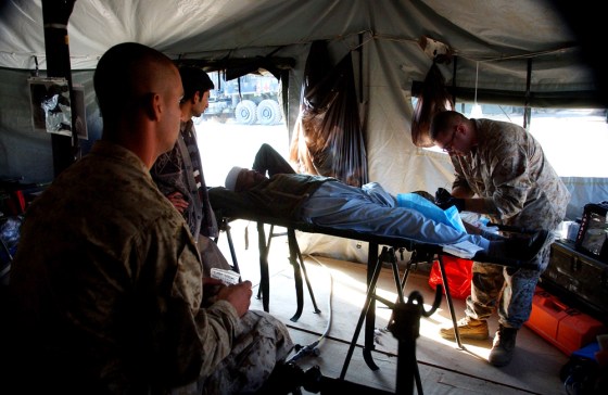 A local villager receives treatment Sunday at a U.S. military field hospital in Shinkiari, Pakistan. The American military, which offered humanitarian aid after last year's deadly tsunami, has once again mobilized for mercy in South Asia.