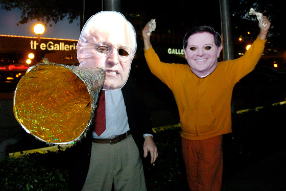 Demonstrators wearing masks of Tom DeLay, right, and Vice President Dick Cheney attend a Monday rally outside a Houston hotel where a Cheney fundraiser was held. Their derision reflects results of a survey that find Americans thinking corruption is endemic to a political system awash in lobbying money and demand for cash.