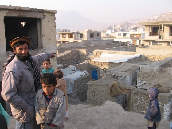 Hazrat Gul, 45, points to the home in Kabul where he and his family have lived for the past several years.