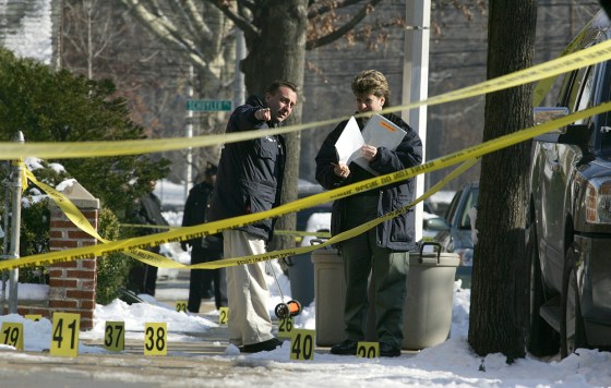 Police investigate the crime scene in the Bronx, N.Y., Saturday, Dec. 10, 2005, where off-duty NYPD officer, Daniel Enchautegui, 28, was shot in the chest before dawn.