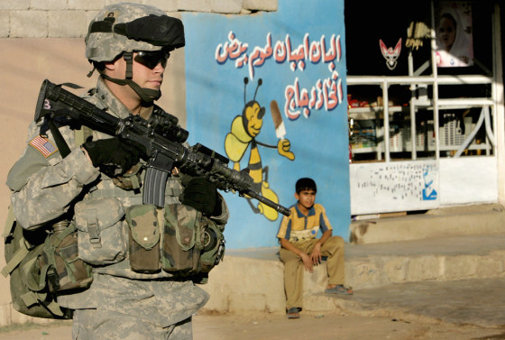 A US soldier secures a neighborhood in d