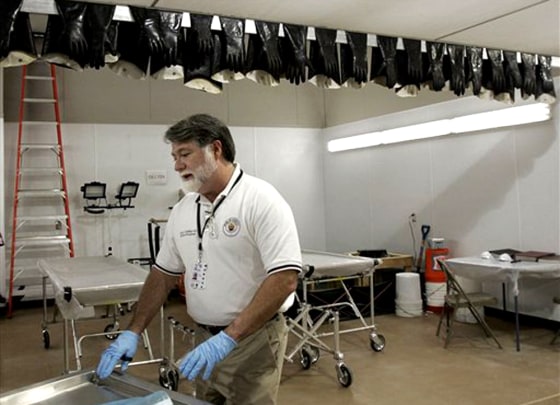 Dr. Louis Cataldie, the Louisiana medical examiner, stands in the Victim Identification Center in Carville, La., on Dec. 1. Cataldie is examining the cause of violent deaths that happened during Katrina.
