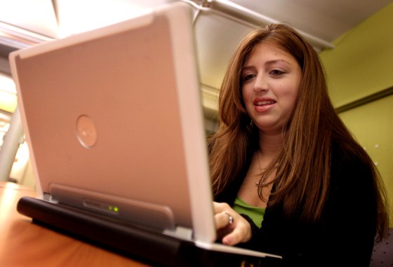 Nicole Quaranta, a graduate student at New York University's Steinhardt School of Education, works on her laptop in a student lounge. She says she does most of her research online.
