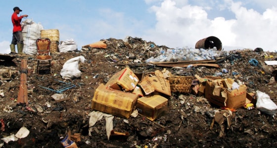 WORKER SORTS DEBRIS