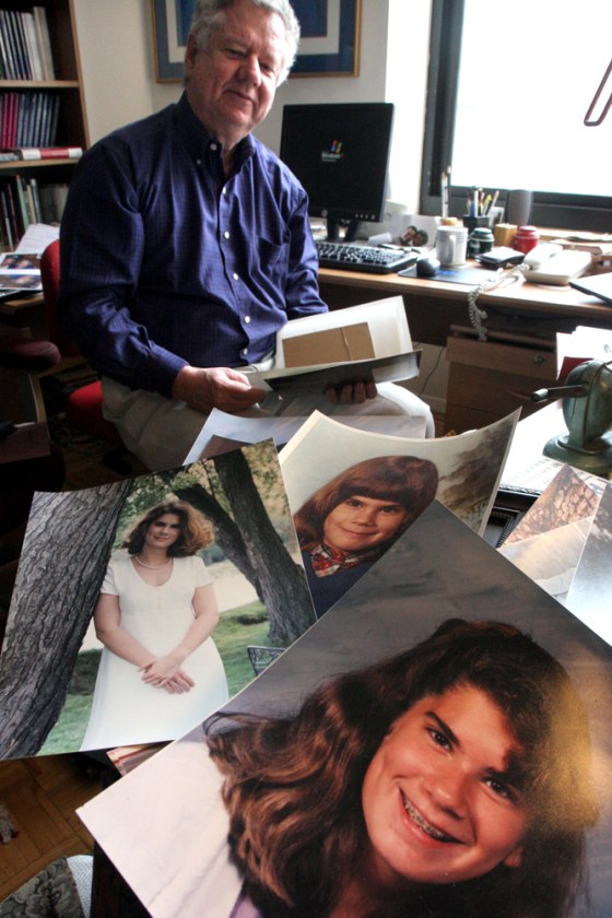 Robert Weissberg pauses as he looks for photographs of his daughter Nicole, 27, as several he has already found, lay on the desk next to him last week in his apartment in New York. Weissberg's 27 daughter, a University of Denver student, was killed a year ago in the Dec. 26 tsunami during a trip to Southeast Asia. 