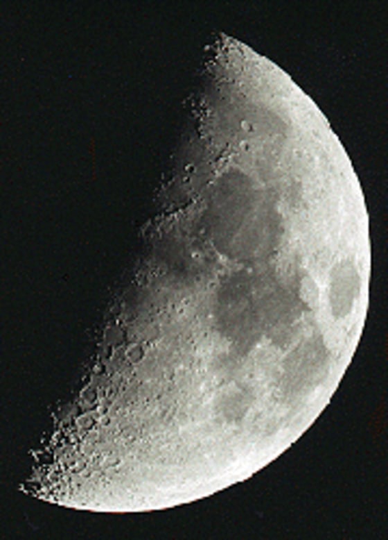 Mountains and shadowed craters provide plenty of visual interest when the moon is half full.