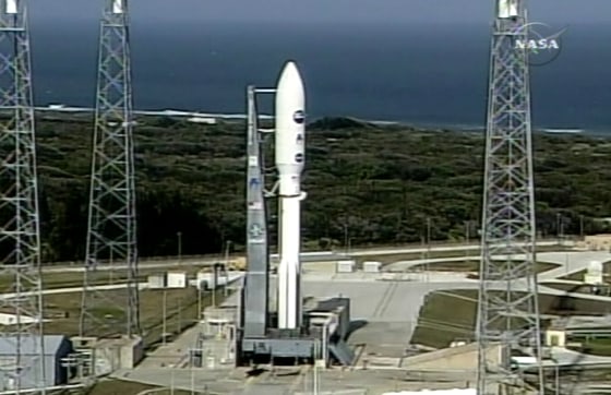 The New Horizons spacecraft sits atop an Atlas 5 launch vehicle on the launch pad in Cape Canaveral, Fla., on Tuesday.