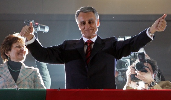 Portugal's new president Anibal Cavaco Silva greets supporters after the electoral results announcement in Lisbon